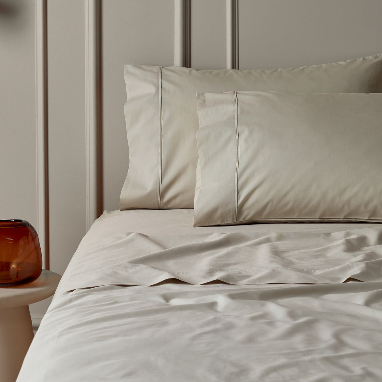 Lifestyle shot of Premium Percale Oyster Sheets on bed