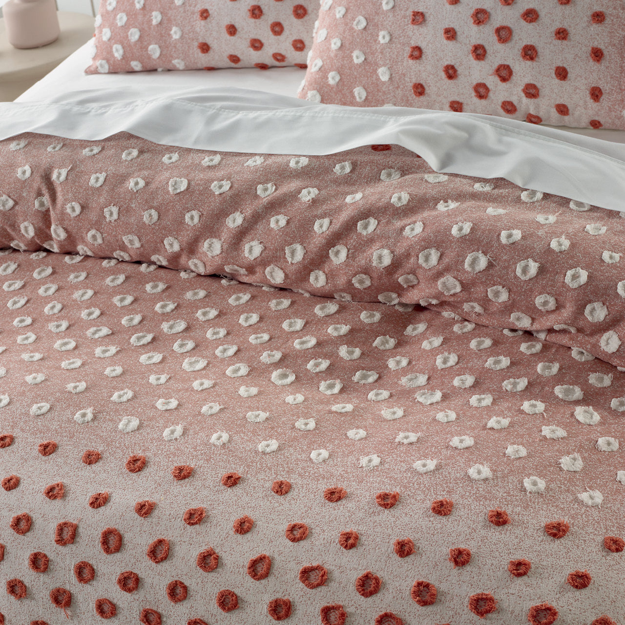 Close up shot of Ruby Quilt Cover Set on bed