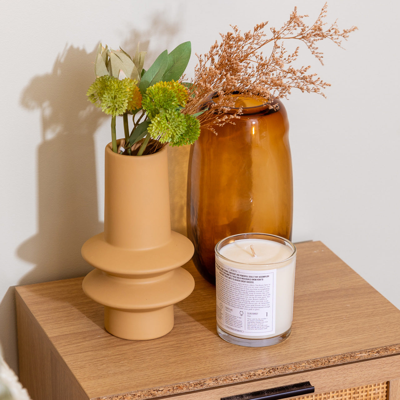 Lifestyle shot of Serra Vase Yellow on bedside table with flowers