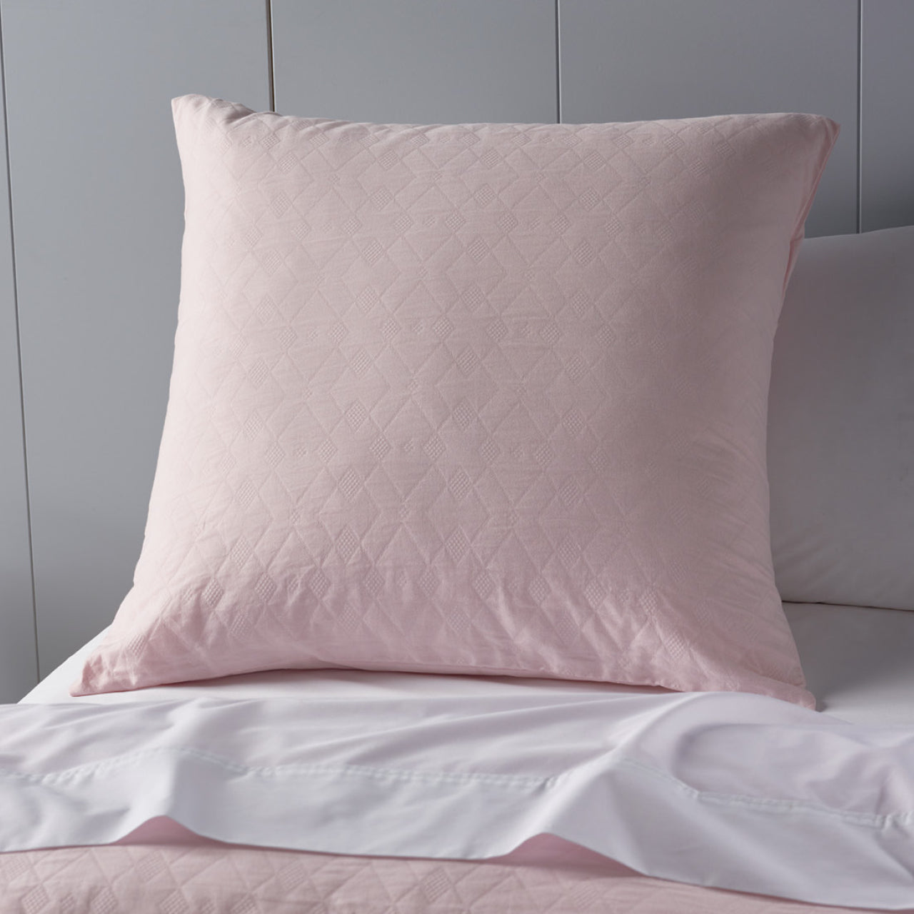 Zoomed in shot of Shani European Pillowcases on bed