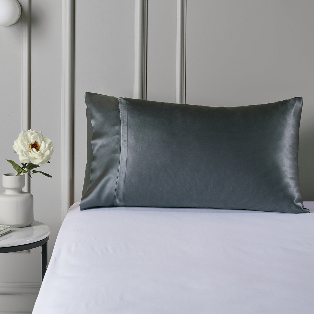 Close up of Silk Royale Pillowcase Charcoal on bed