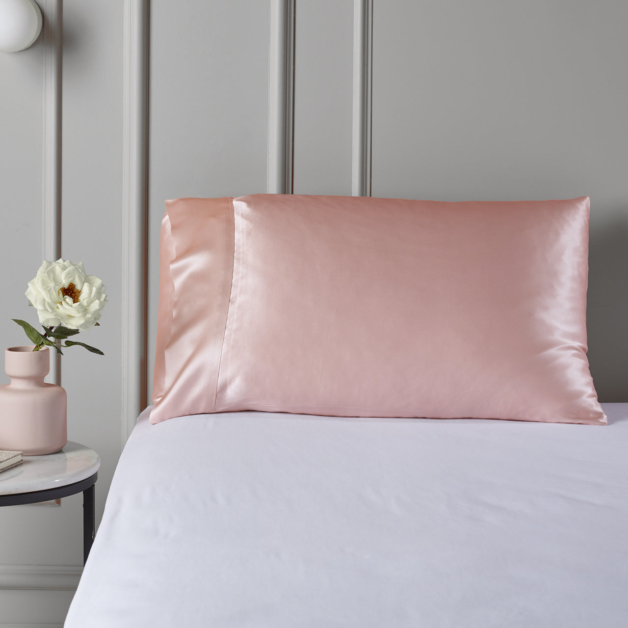 Close up shot of Silk Royale Pillowcase Dusty Pink on bed