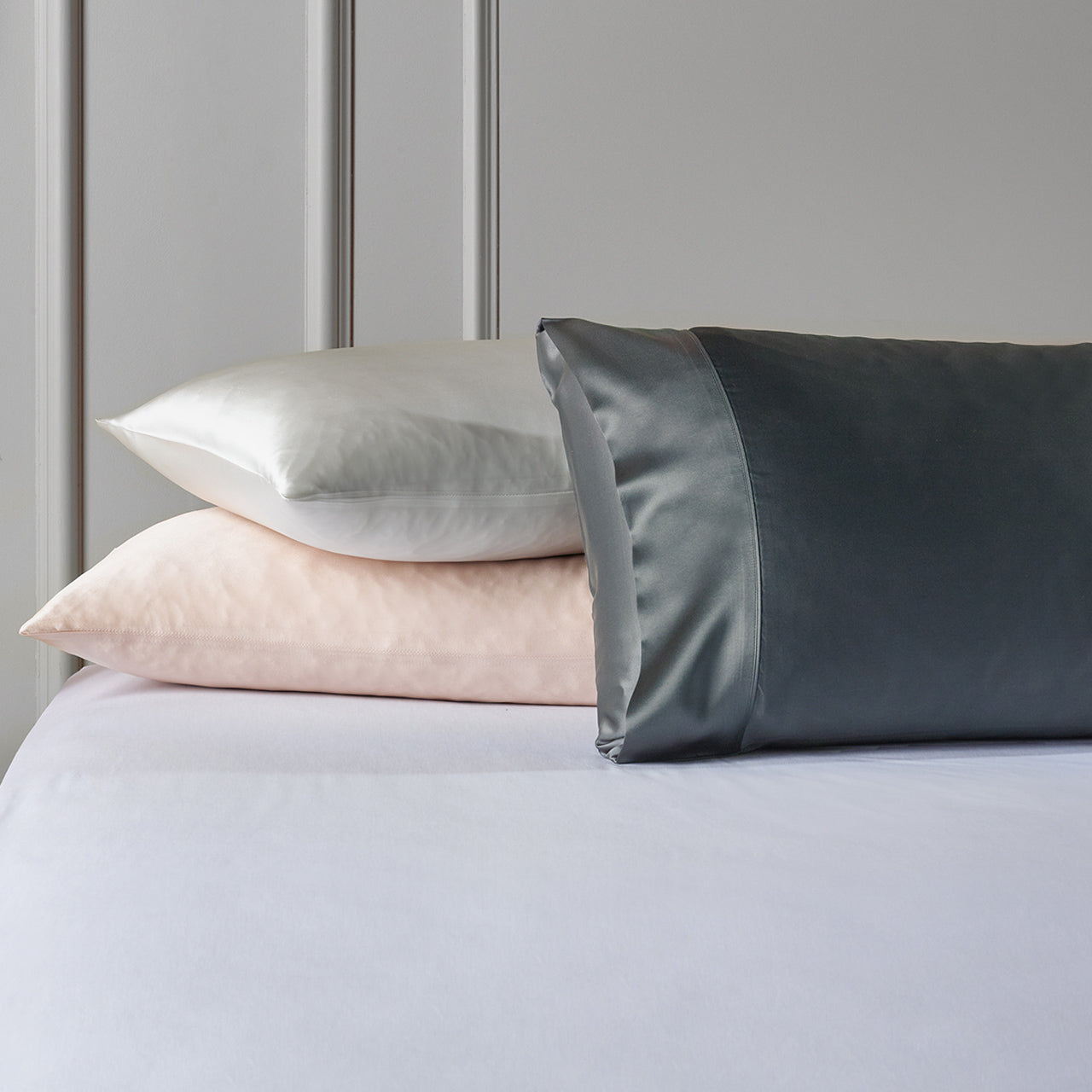 Group shot of all Silk Royale Pillowcases on bed