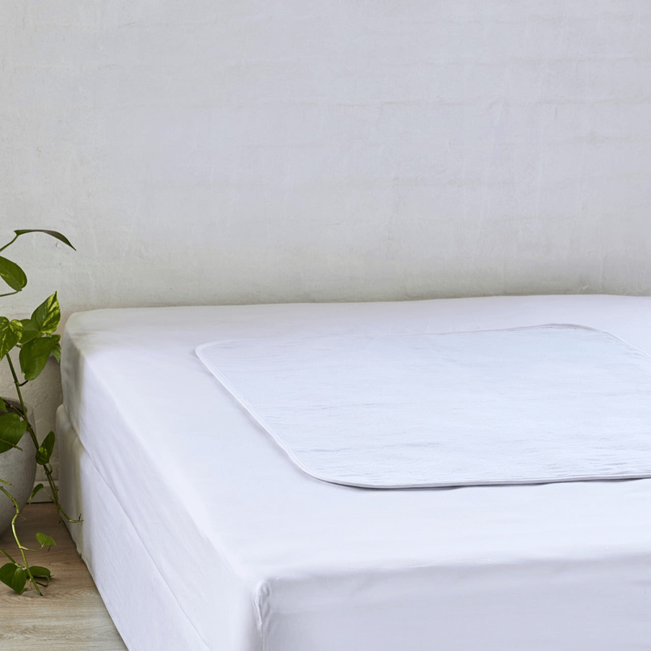 Zoomed out shot of Sleep Easy Bed Mat on bed
