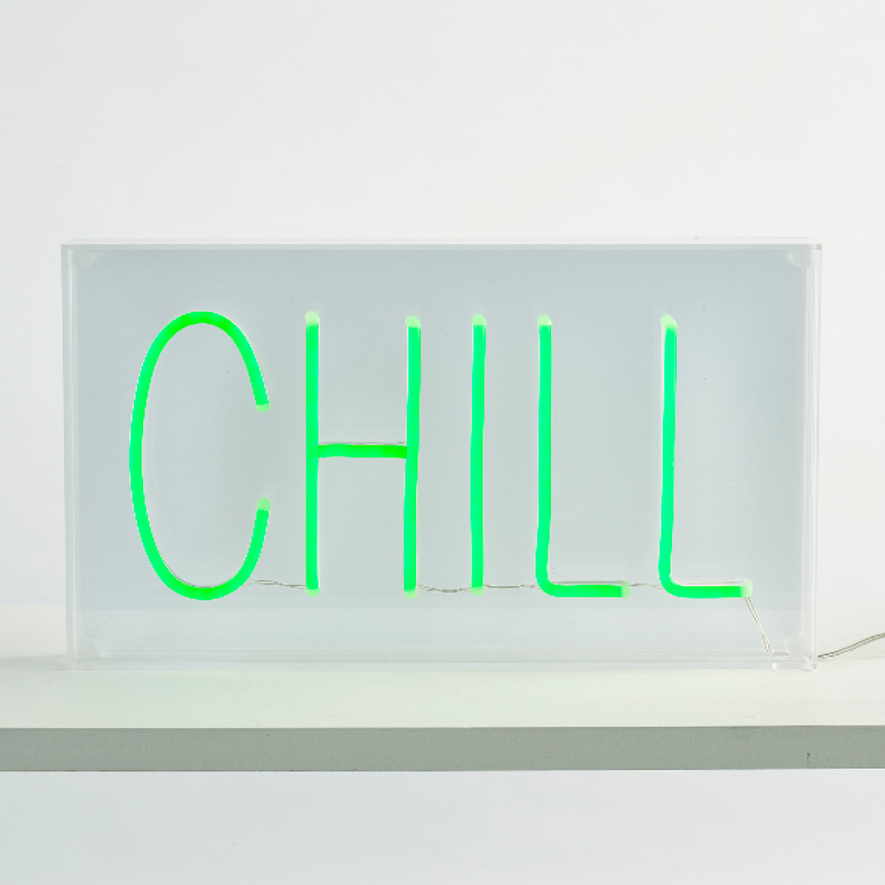 Sloth Neon Light Sign sitting on a ledge