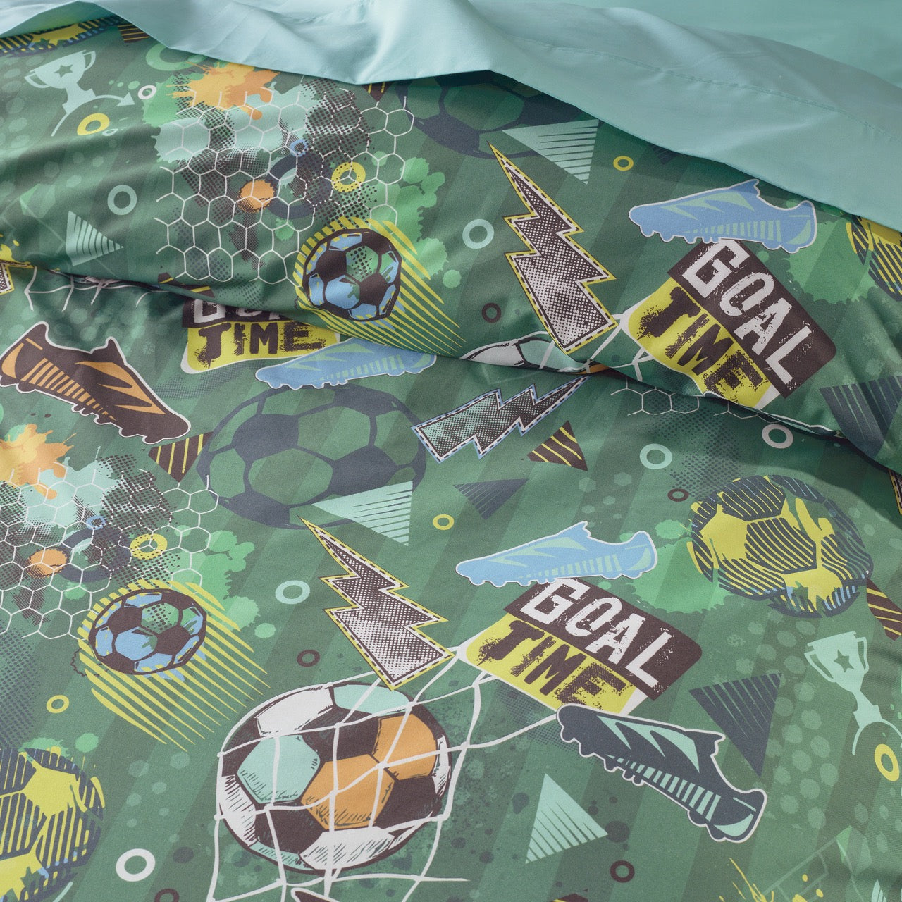 Close up shot of Soccer Quilt Cover on bed