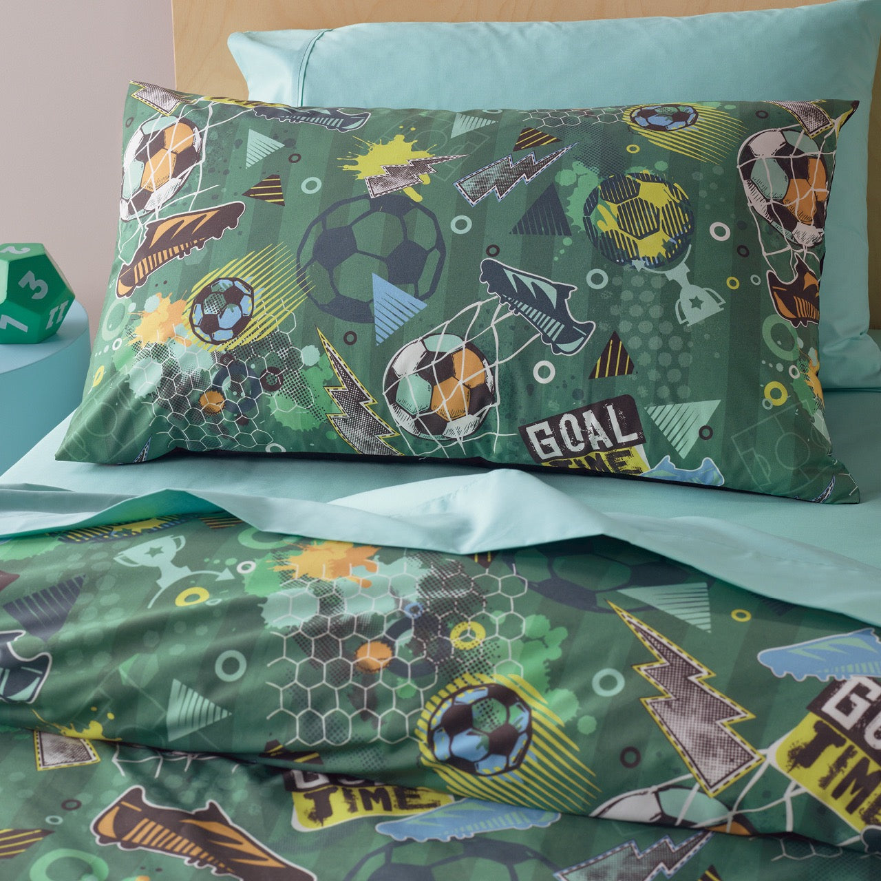 Close up shot of Soccer Pillowcases on bed