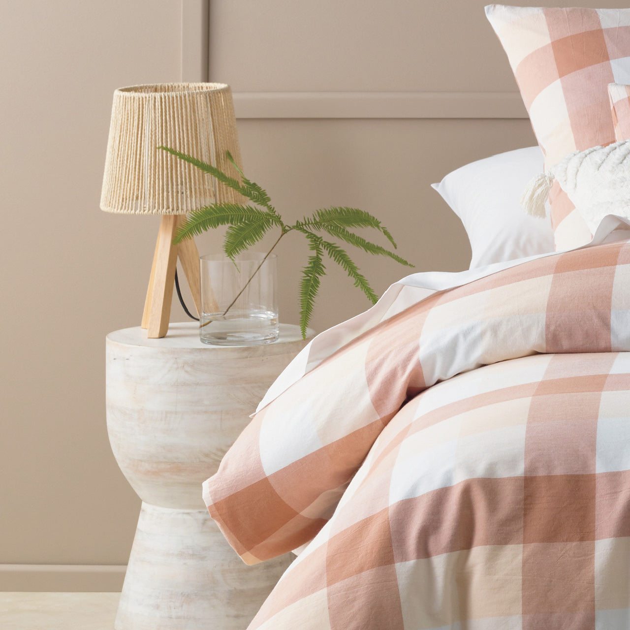 Solaire Vase next to bed with flower and lamp