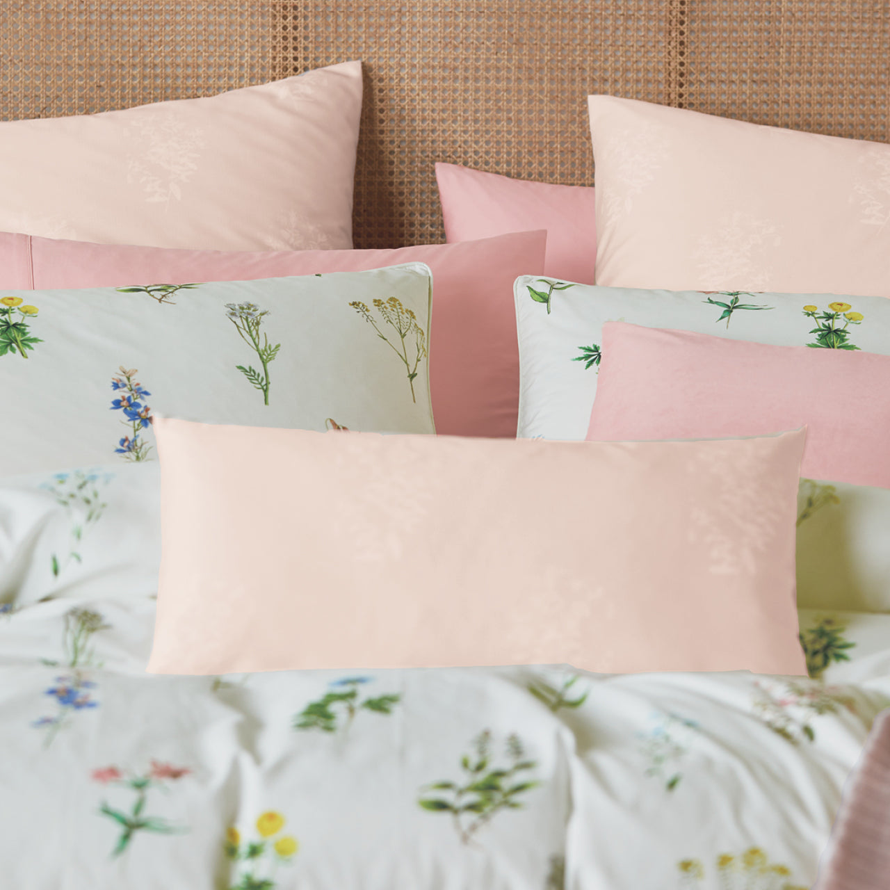 Close up shot of Spring Garden Pillowcases on bed