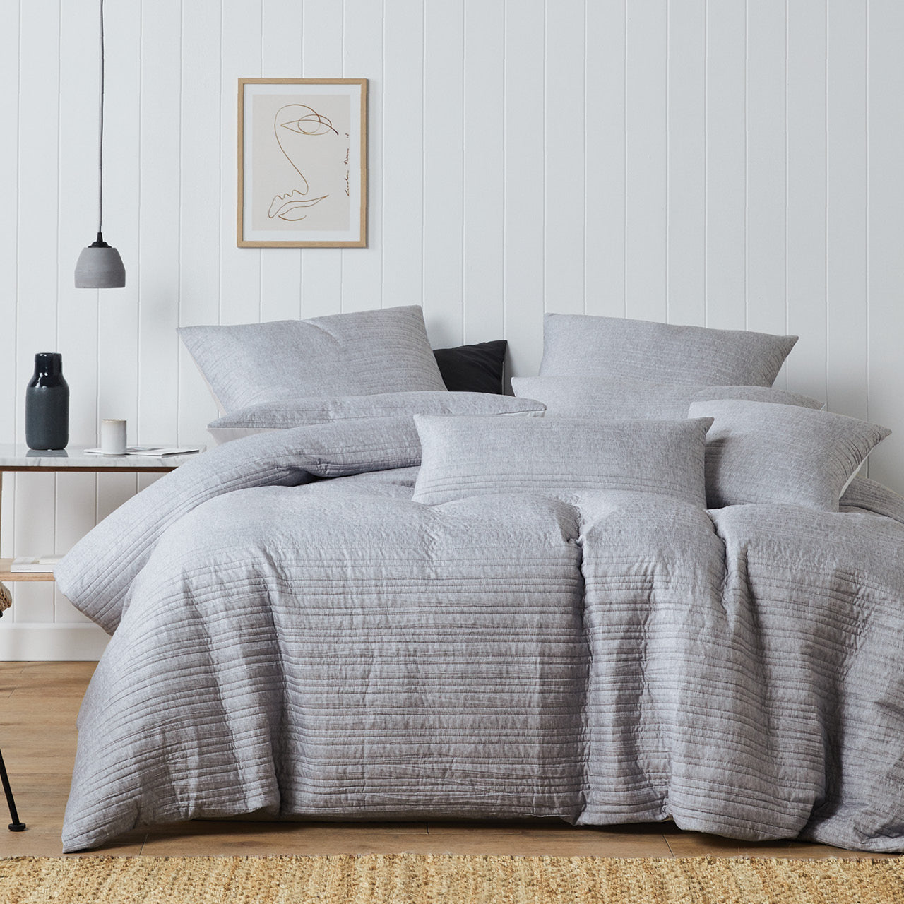 Front on shot of Taya Grey Marle Quilt Cover Set styled on bed