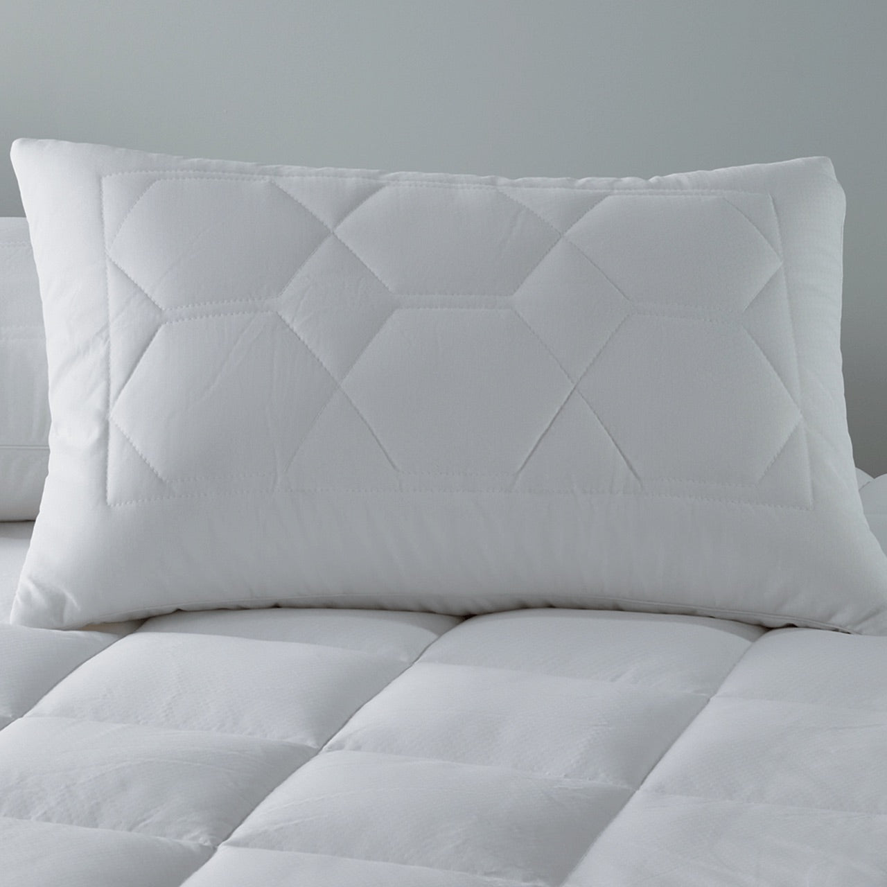 Zoomed in shot of Thermal Balancing Pillow Protector on bed