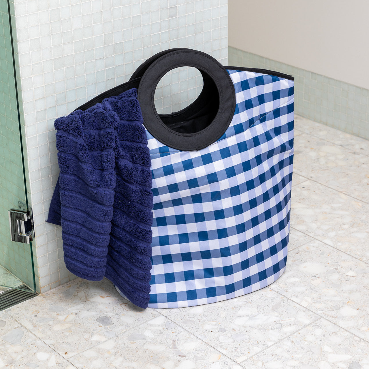 Trinity Laundry Bag in bathroom with a towel inside and handles out