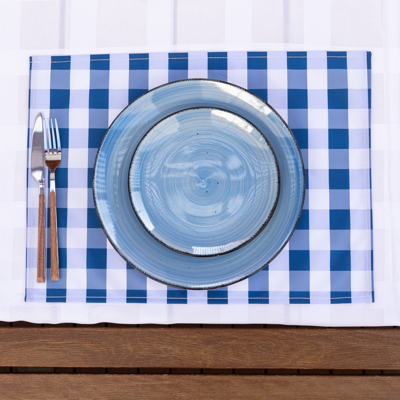 Trinity Placemat on table with cutlery and plates overhead shot