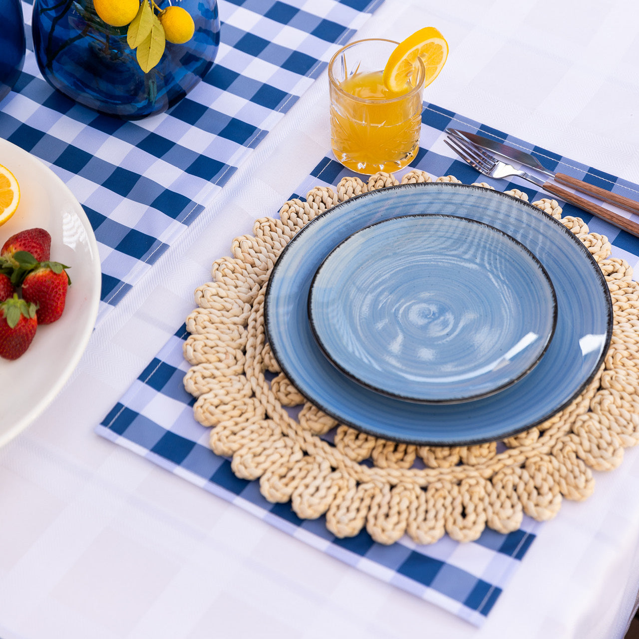 Lifestyle shot of Trinity Placemats on table with food and drinks