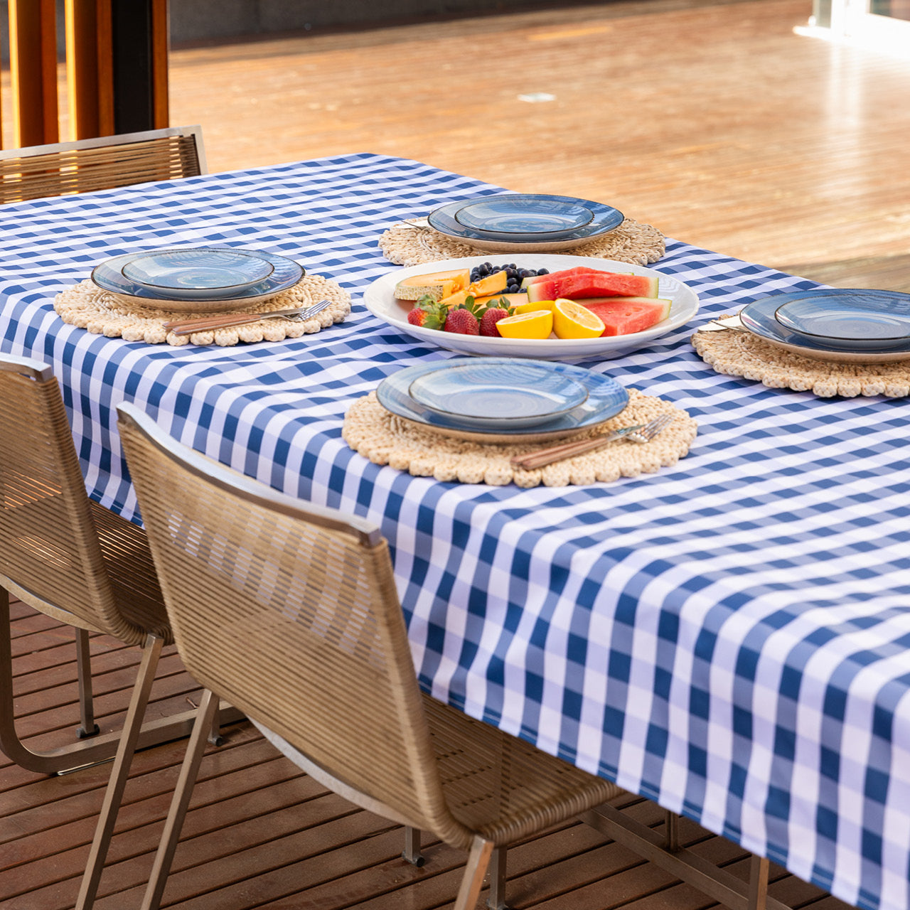 Lifestyle shot of Trinity Tablecloth on table with food and placemats