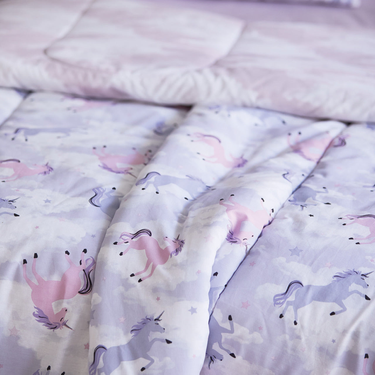 Close up shot of Unicorn Comforter Set on bed