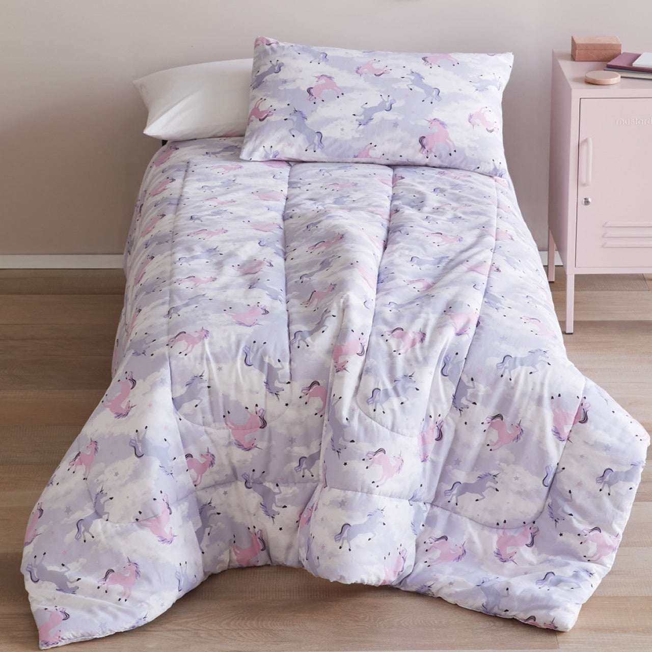 Zoomed out shot of Unicorn Comforter Set on bed