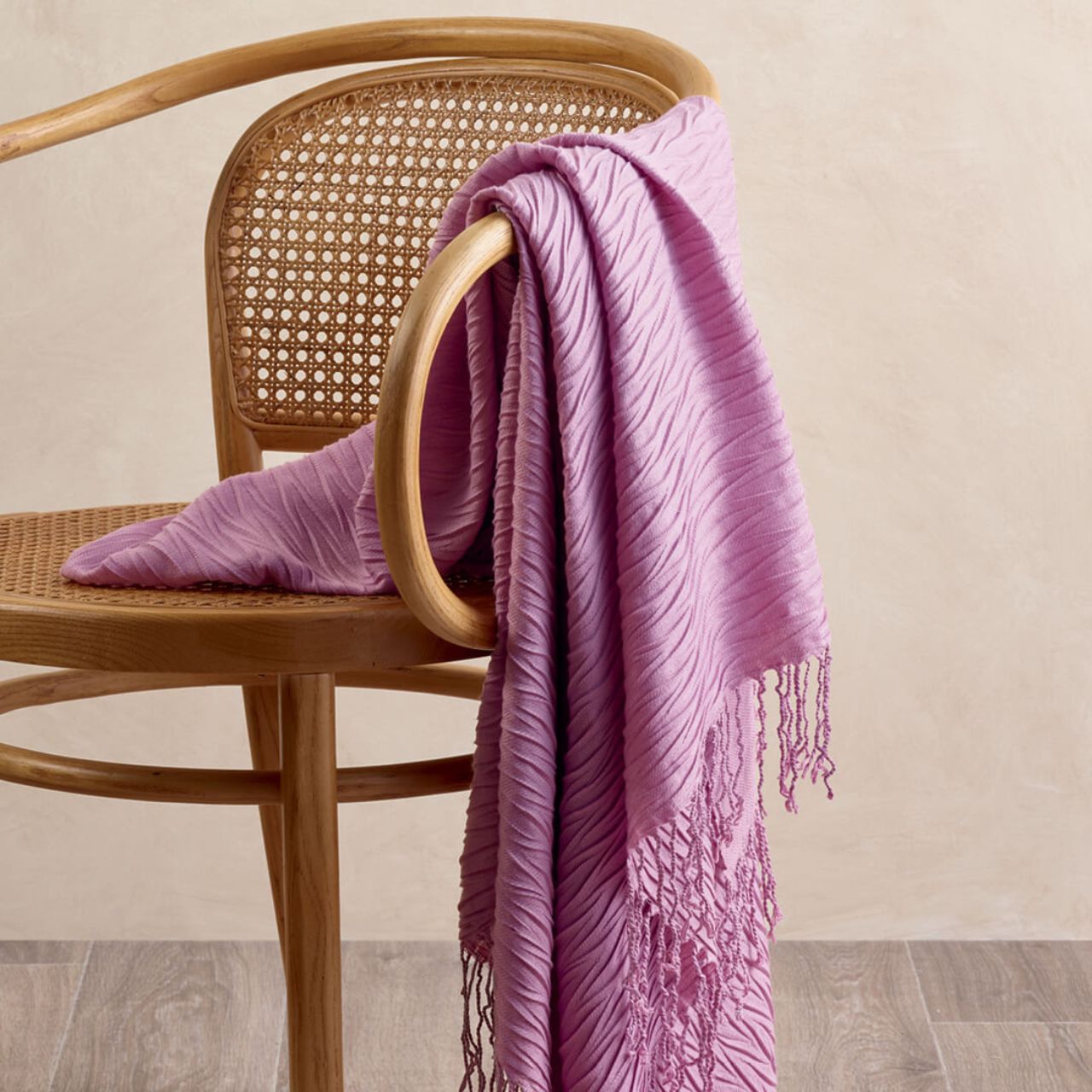 Willow Throw Rug Mauve over chair