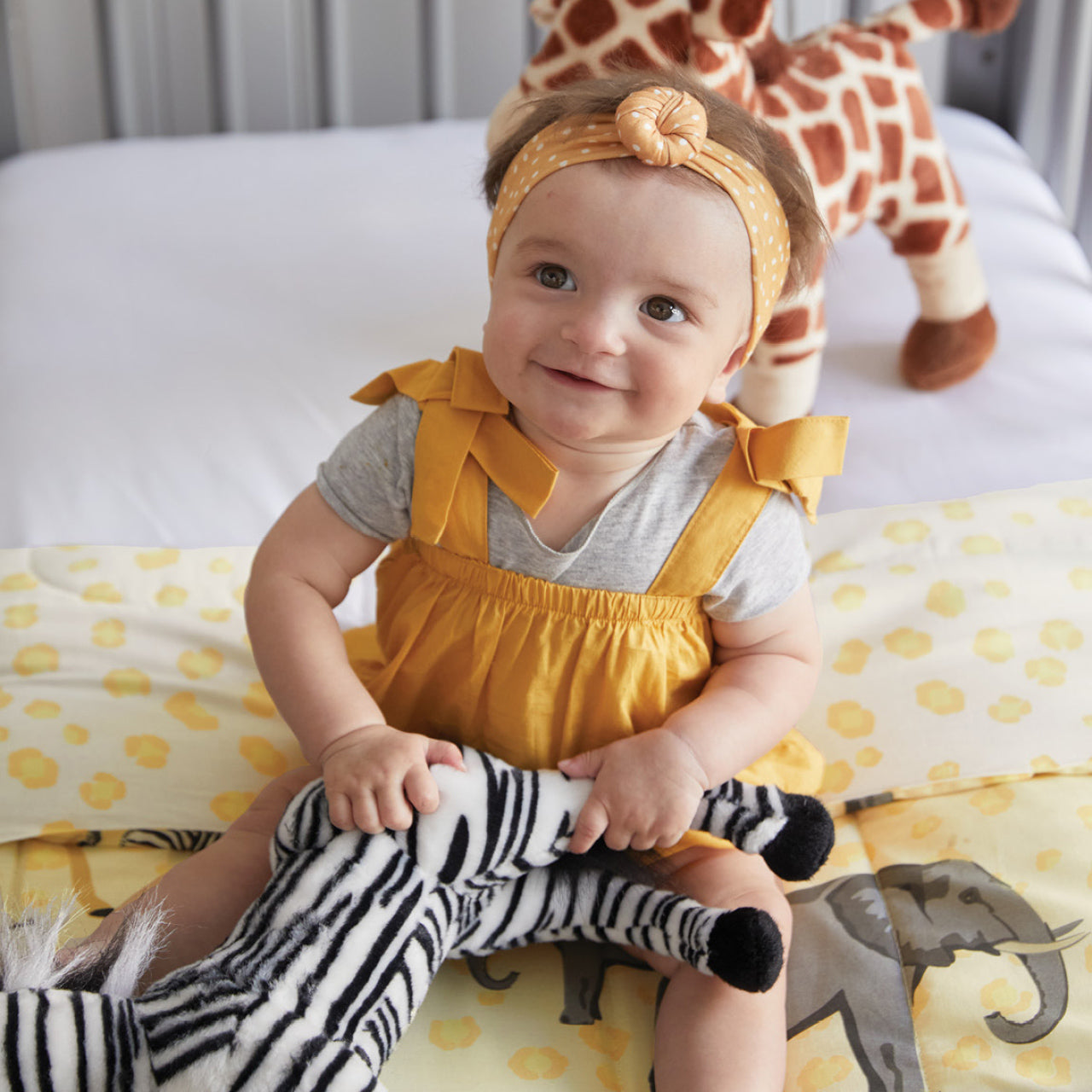 Lifestyle shot baby playing with Zebra Soft Toy