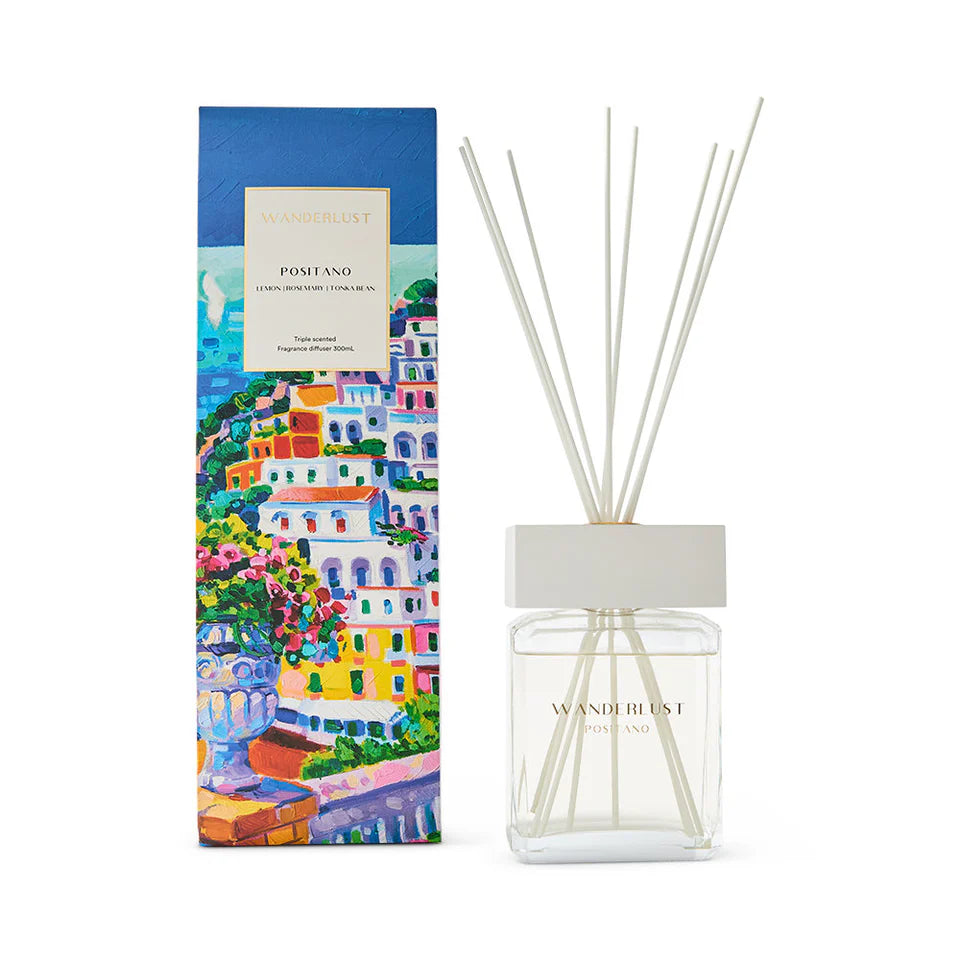 Diffuser with decorative packaging featuring a colorful scene of buildings and flowers.