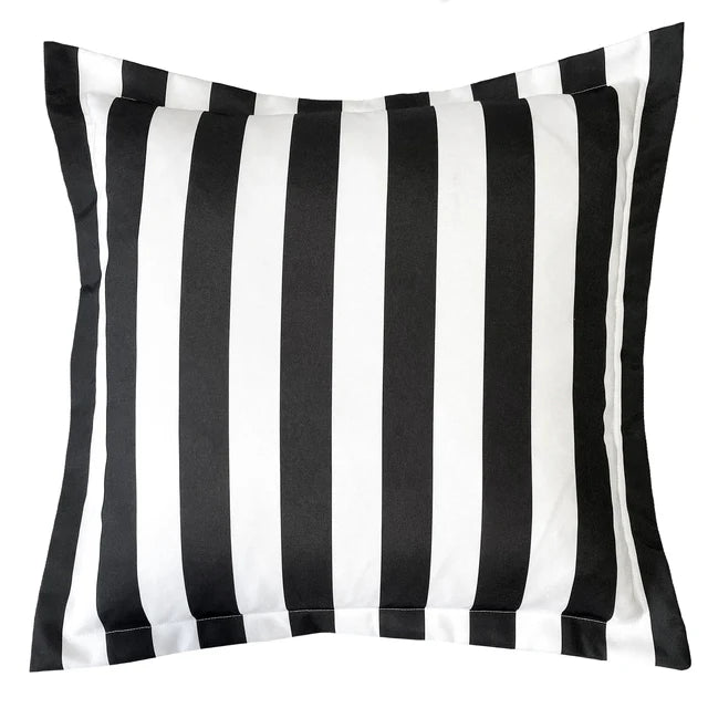 Black and white striped pillow on a white background