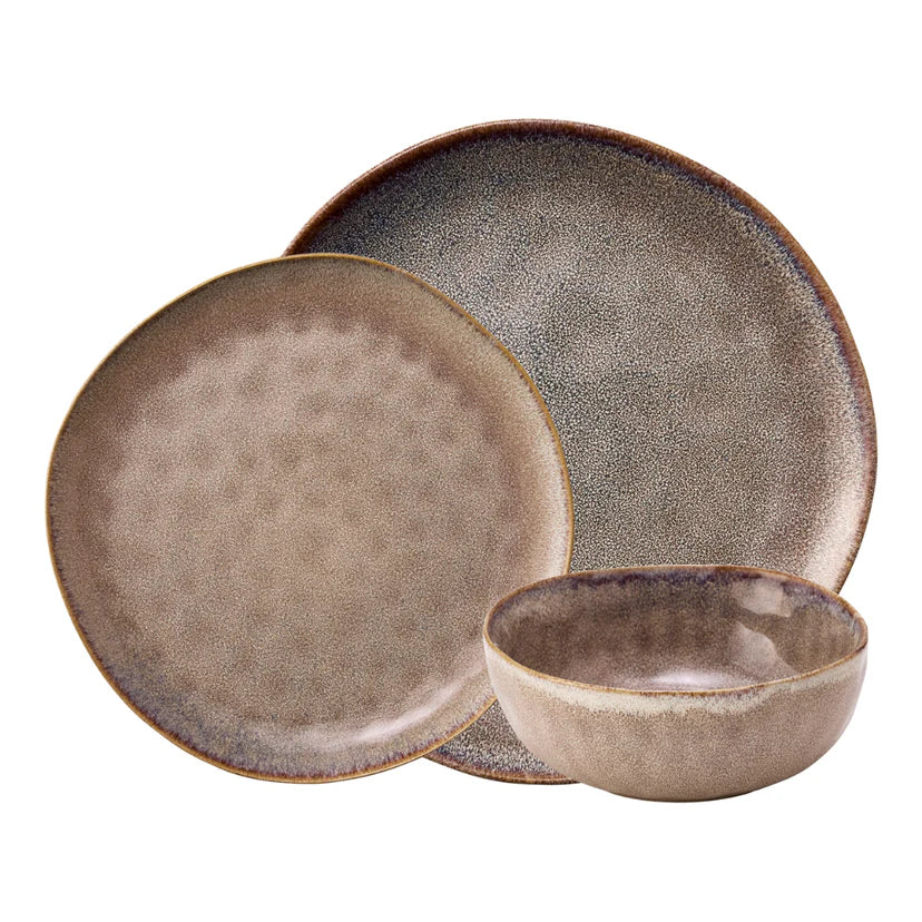 Set of ceramic plates and a bowl with a textured finish on a white background