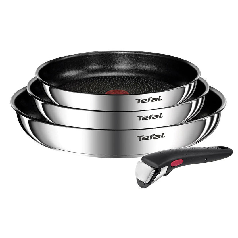 Set of Tefal cookware including frying pans and a ladle on a white background