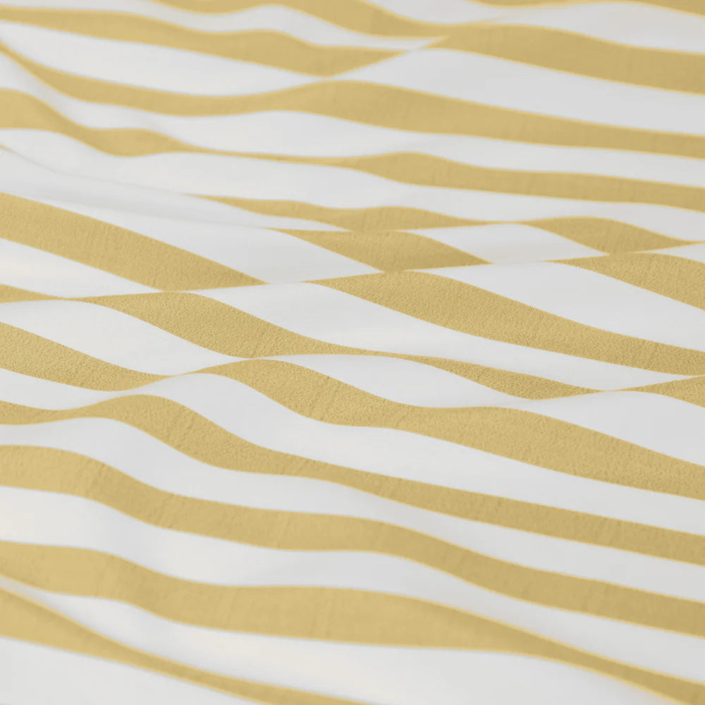 Fabric with yellow and white wavy pattern
