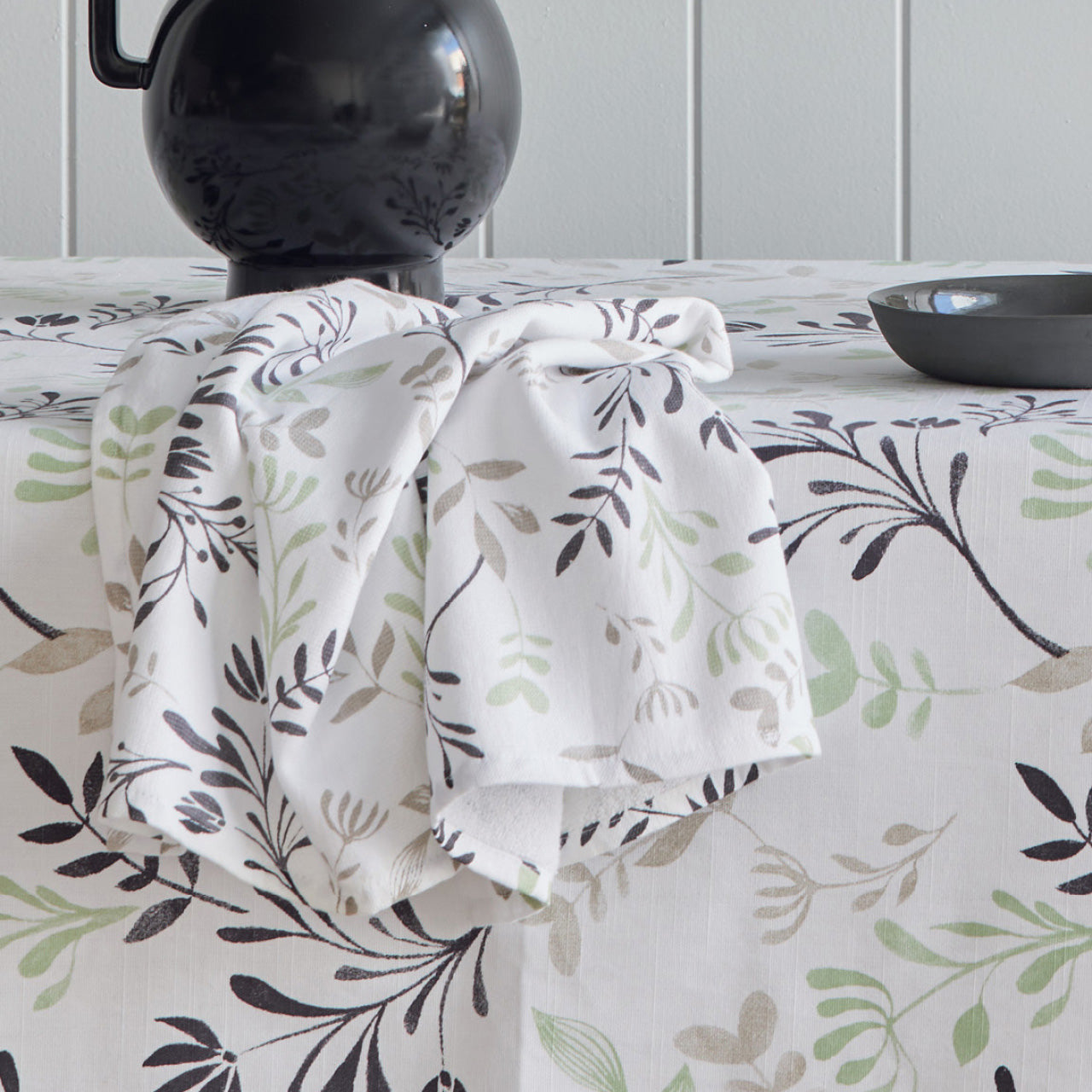 Zoomed in shot of Ambrosia Tablecloth and Tea Towel on dining table