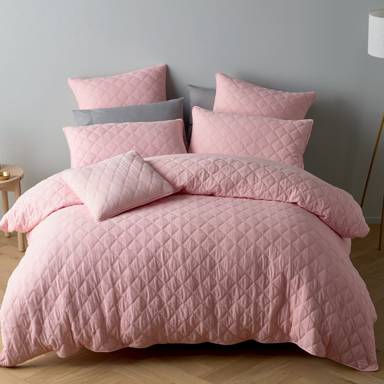 Zoomed out shot of Austin Pink Quilt Cover Set on bed