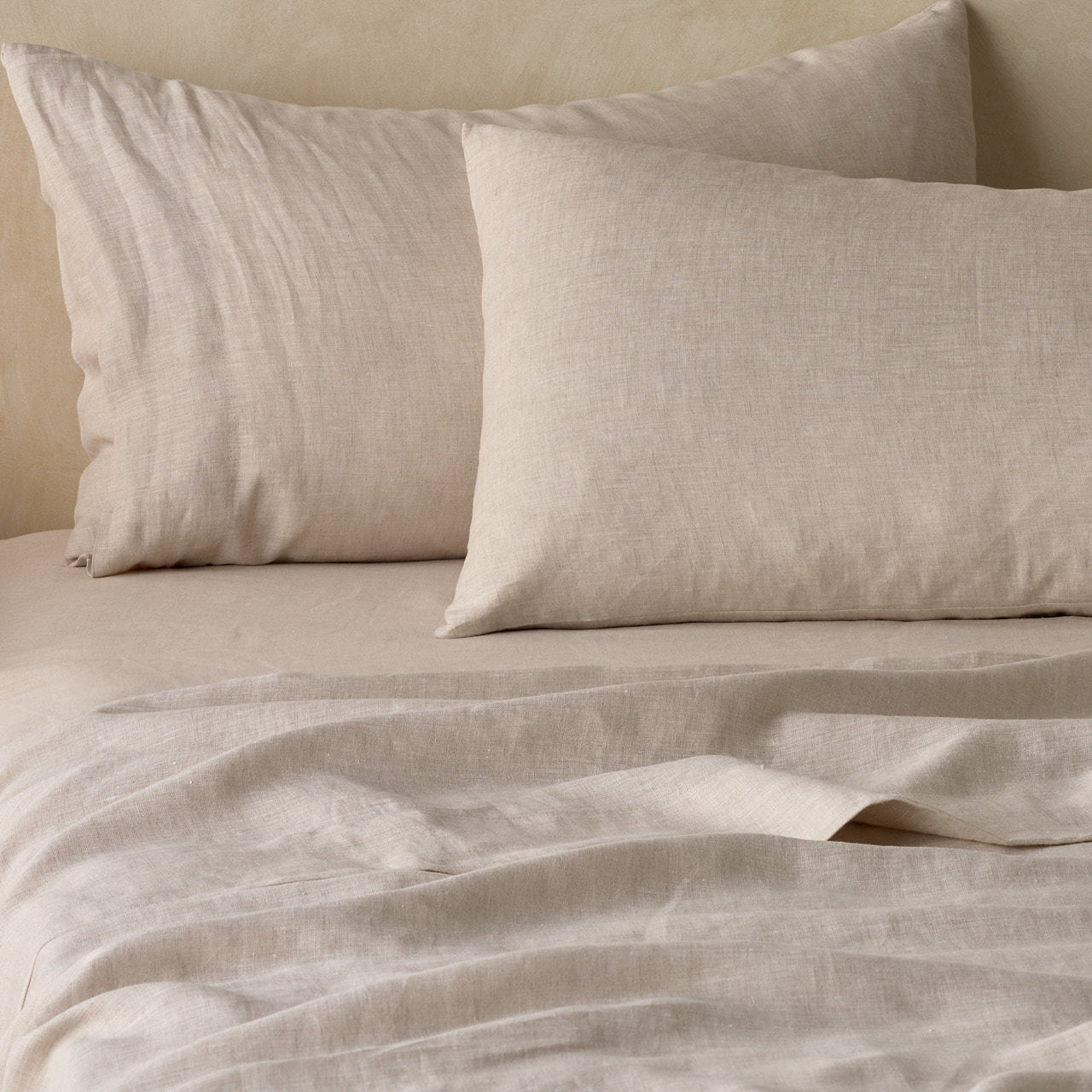 Zoomed in shot of Elayna Natural Pillowcases on bed