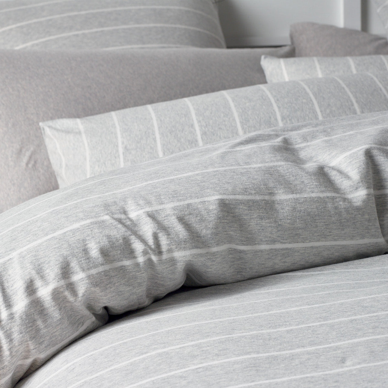 Close up shot of Henley Grey Quilt Cover Set on bed