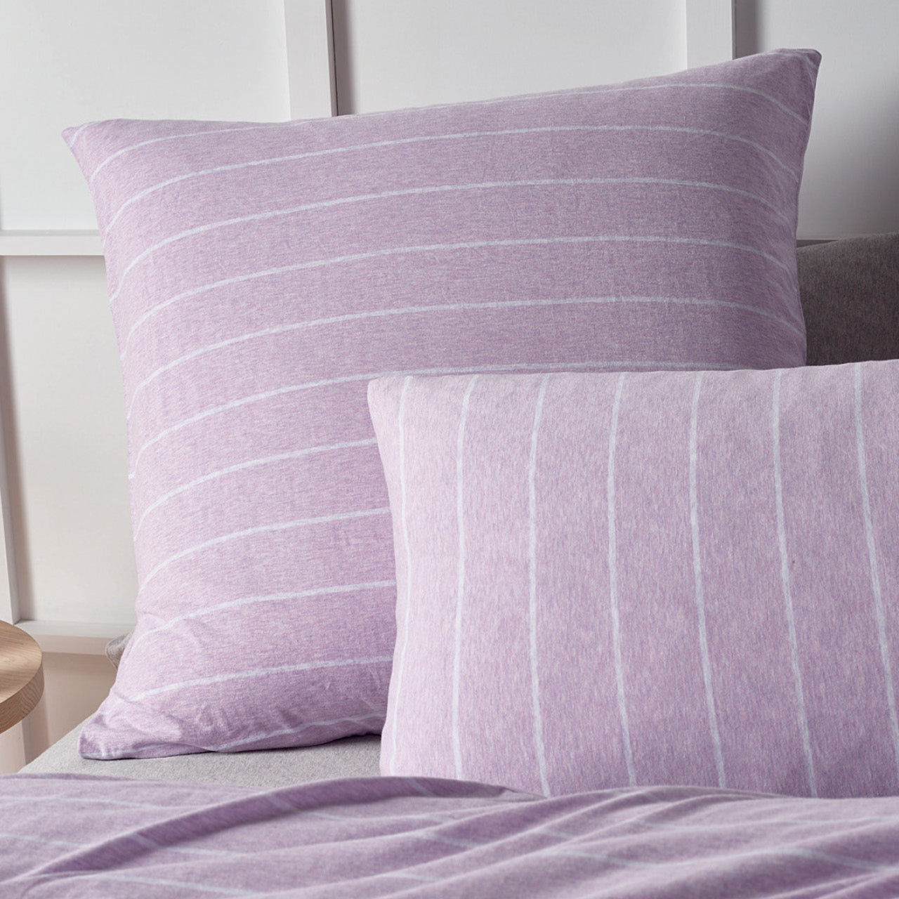 Zoomed in shot of Henley Lilac European Pillowcases on bed